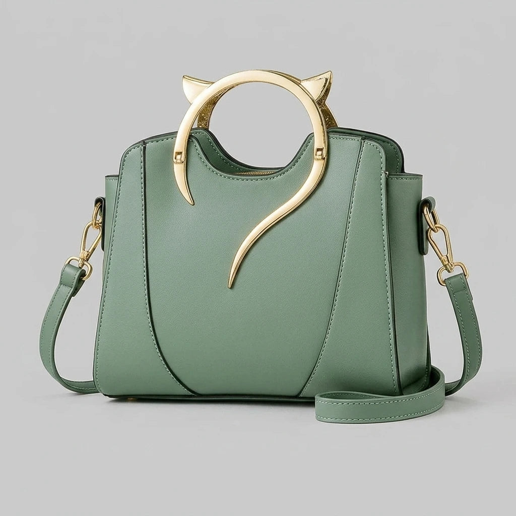 Women's structured handbag with cat handle — front hero shot showing gold cat-ear detail