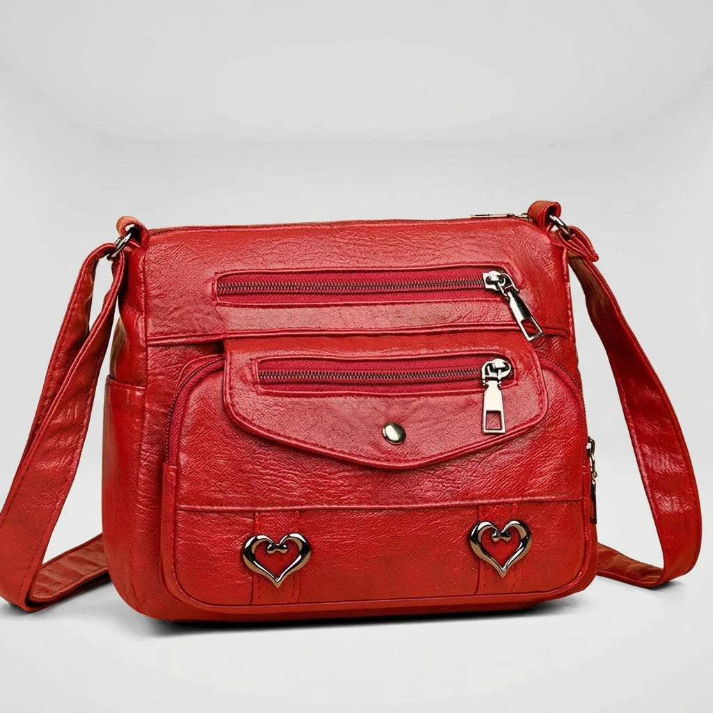 Women's structured shoulder bag in red with gold hardware, front view
