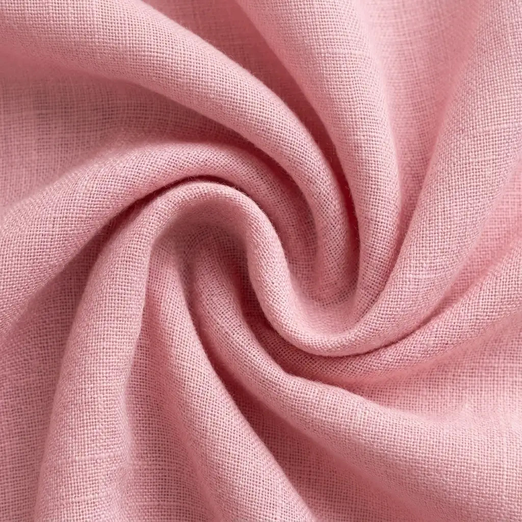 Close-up of woven fabric texture in pink