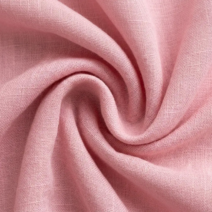 Close-up of woven fabric texture in pink