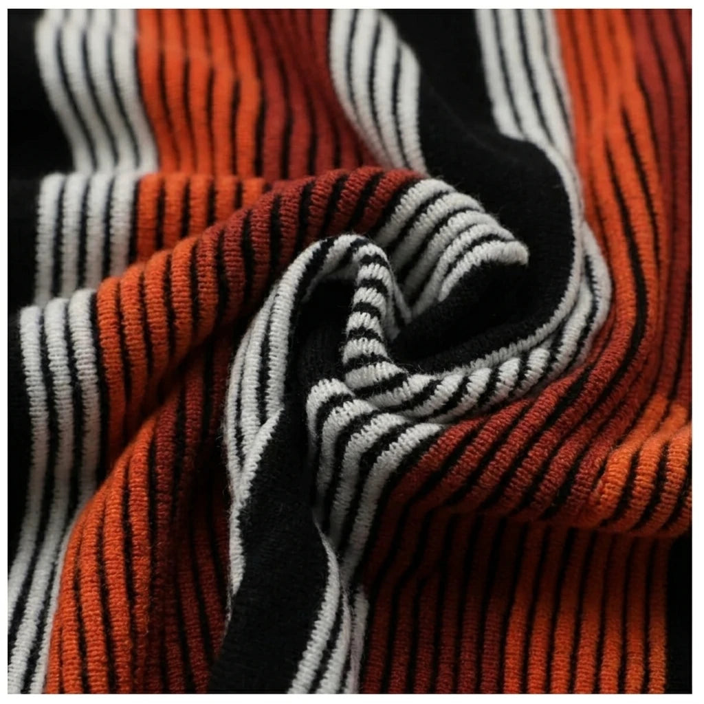 Macro fabric close-up of orange and black striped knit
