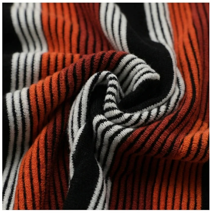 Macro fabric close-up of orange and black striped knit