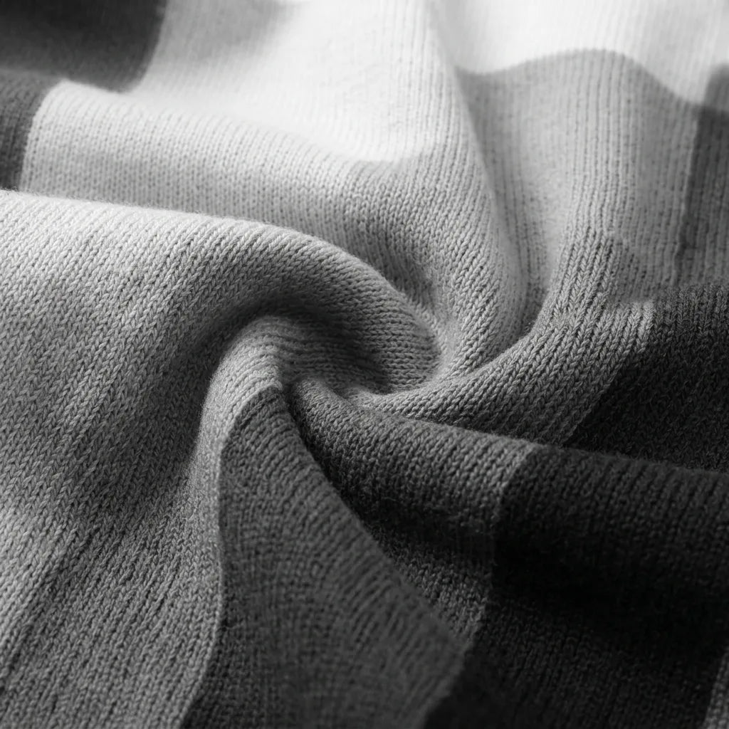 Macro fabric texture of stripe knit polo in gray and white