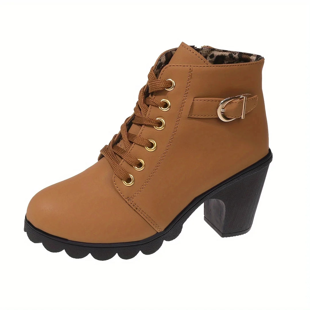 Back view of black chunky heel ankle boots with zipper