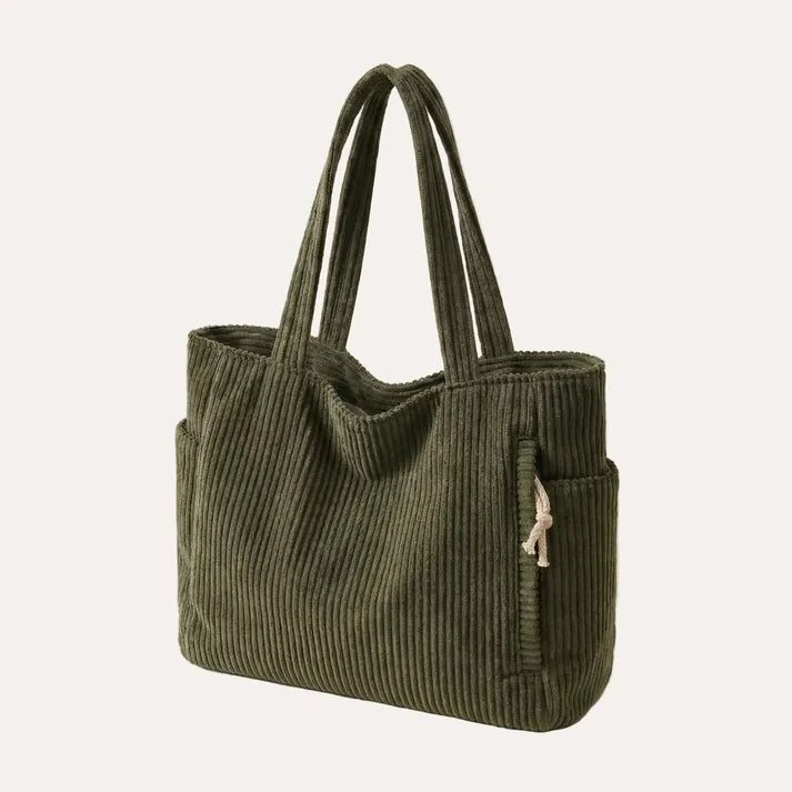 Corduroy tote bag in dark green with zipper closure and ribbed texture, front view
