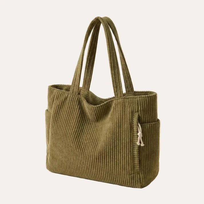 Corduroy tote bag in mustard with zipper closure and ribbed texture, flat lay