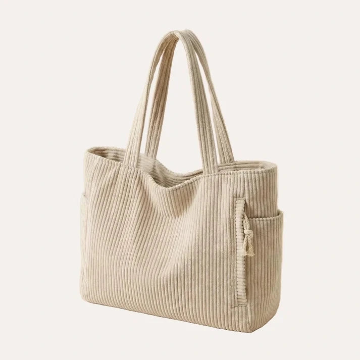 Corduroy tote bag in beige with shoulder strap and outer open pocket, flat lay