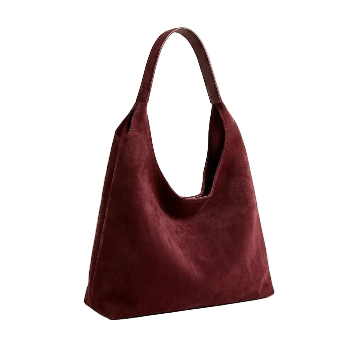 Slouchy hobo shoulder bag in deep burgundy suede on light beige background