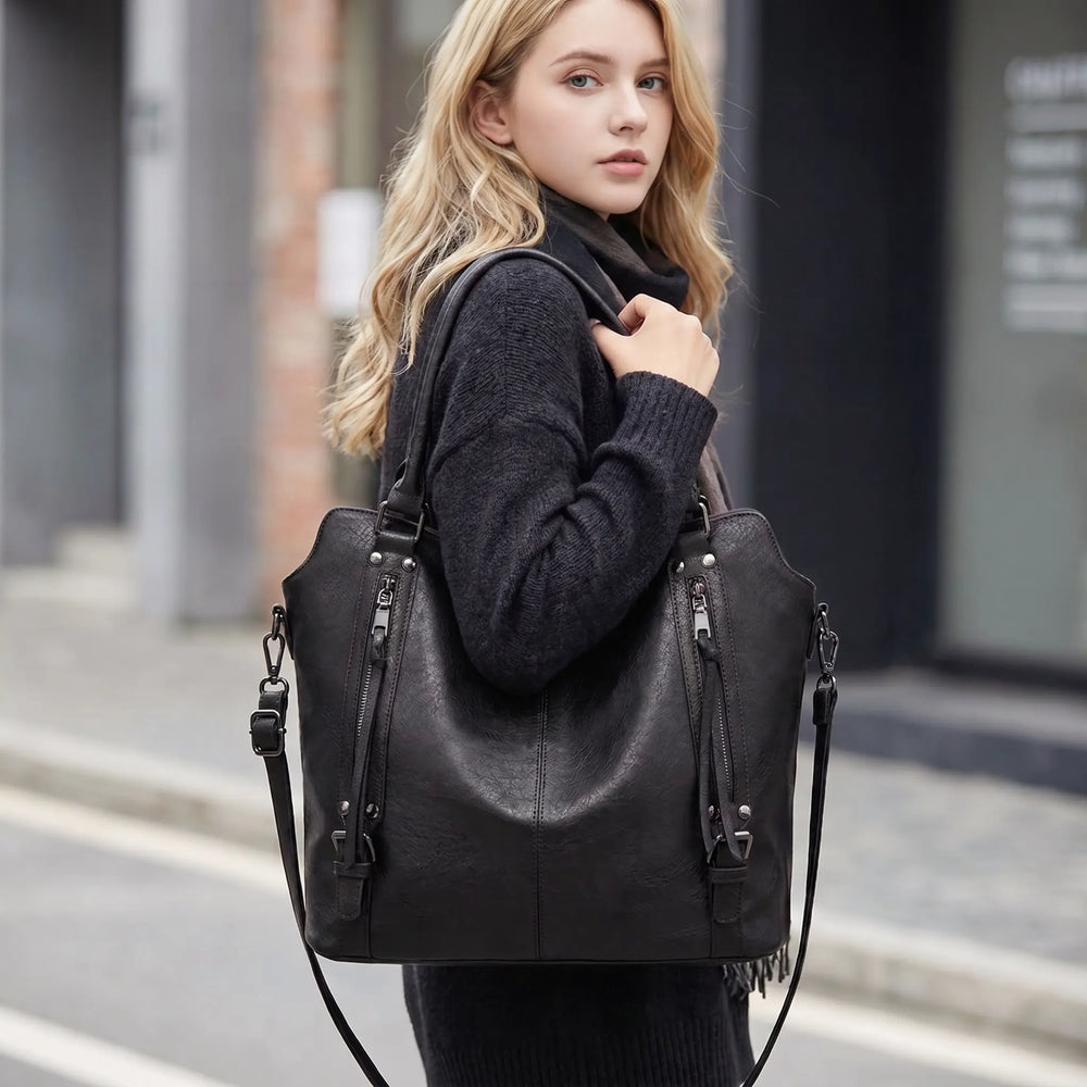 Marcella tote bag side zipper and stud hardware detail