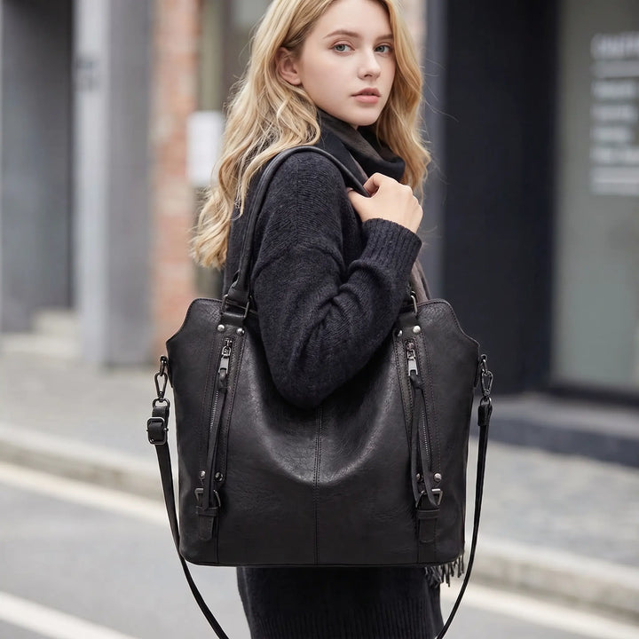 Marcella tote bag side zipper and stud hardware detail