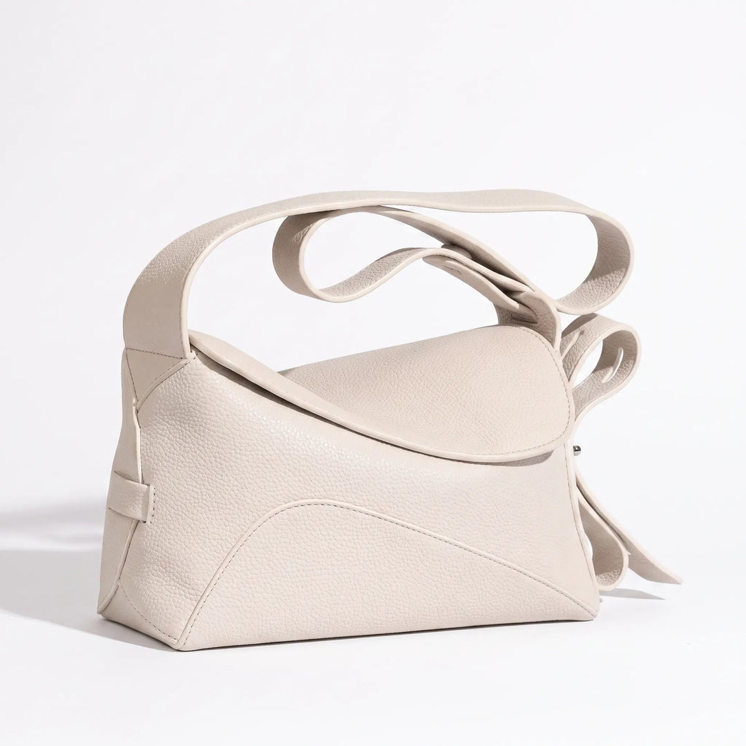 Rectangular structured crossbody bag with flap closure and crossbody strap