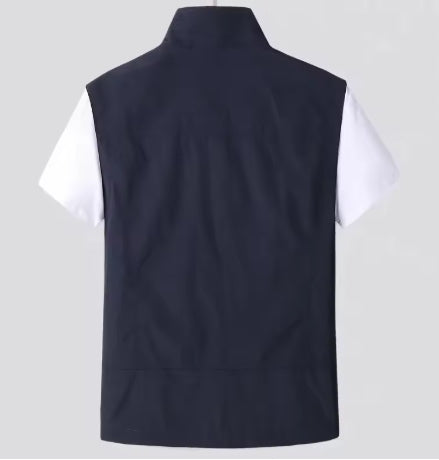 Men's utility vest flat lay showing multi-pocket utility design detail