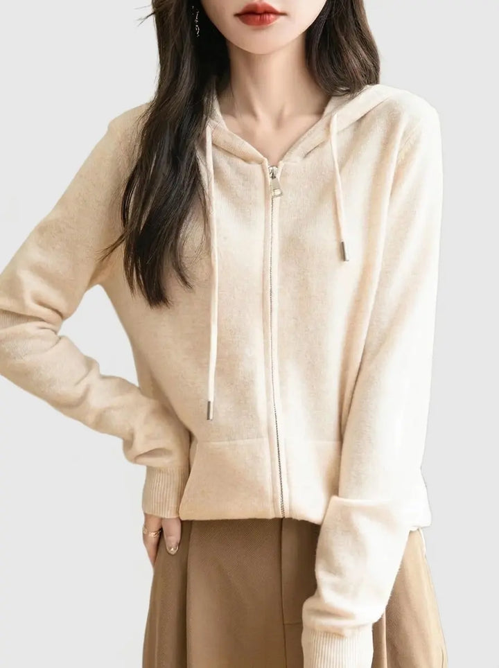 Beige women's zip-up knit hoodie with drawstring hood and kangaroo pocket, front view