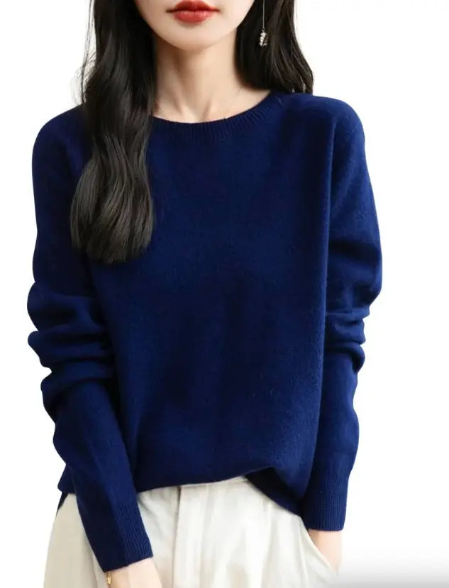 Women's merino wool crewneck sweater in navy blue, front view