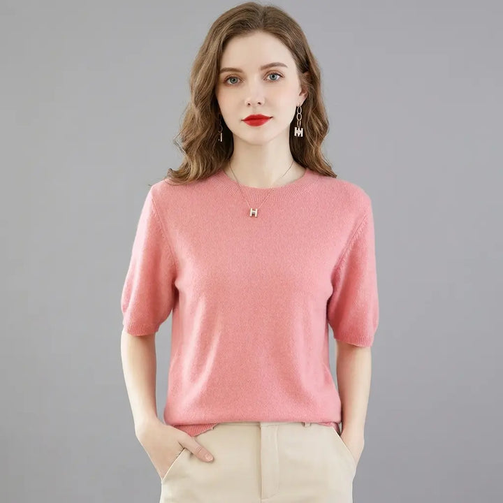Women's knit crewneck sweater top in pink, short sleeve, front view