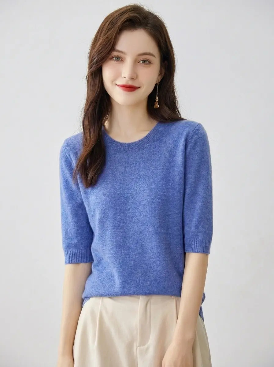 Women's crewneck knit pullover top in blue with short sleeves, front view