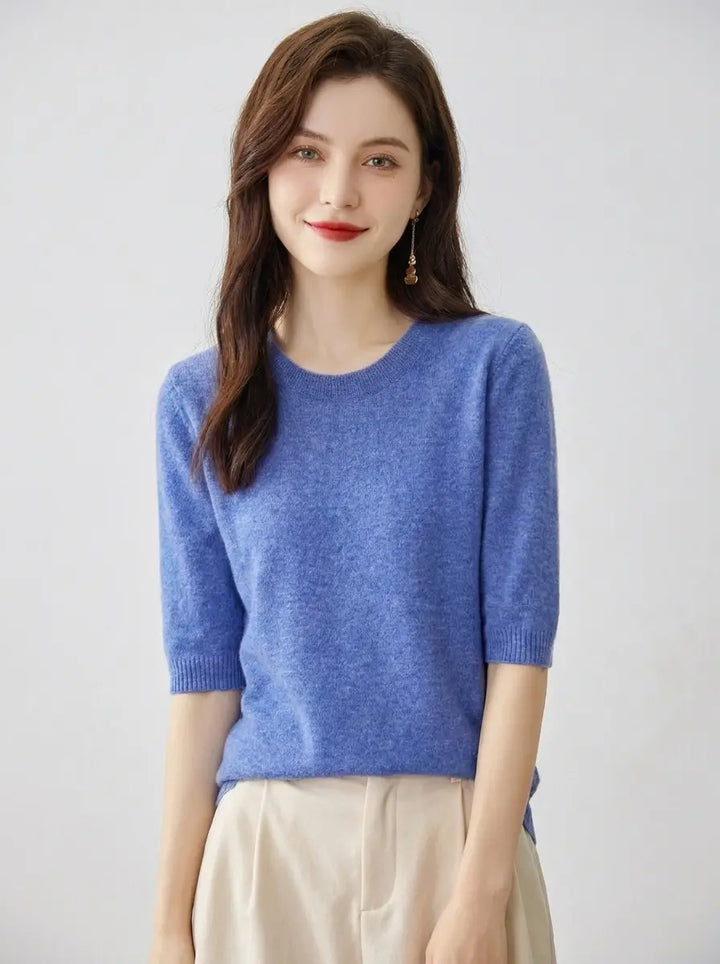 Women's crewneck knit pullover top in blue with short sleeves, front view