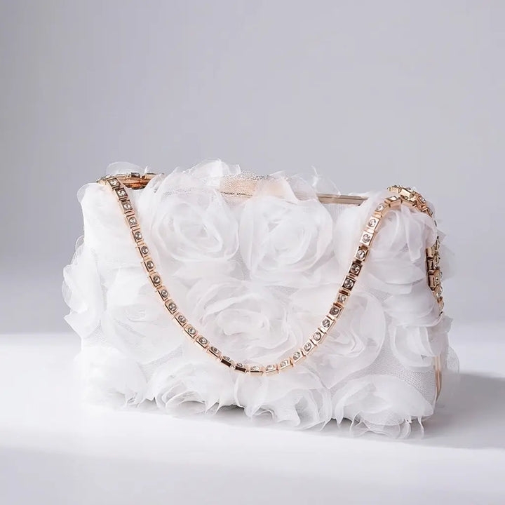 Champagne floral rose applique evening clutch with rhinestone chain strap, side view