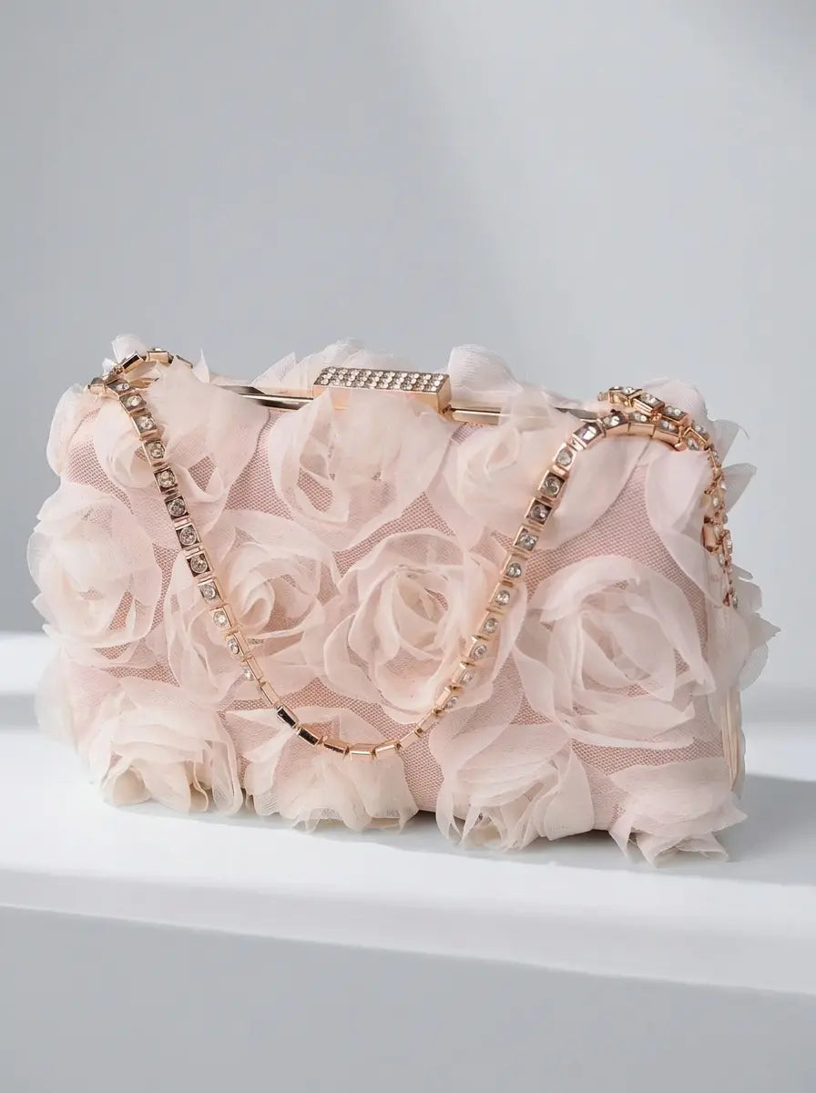 White floral rose clutch carried by model in ivory wedding dress, wedding styling