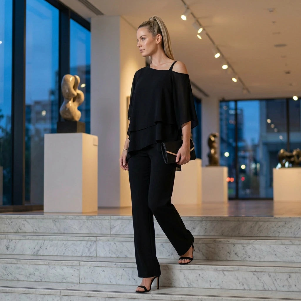 Women's black layered chiffon pants set styled in upscale evening setting