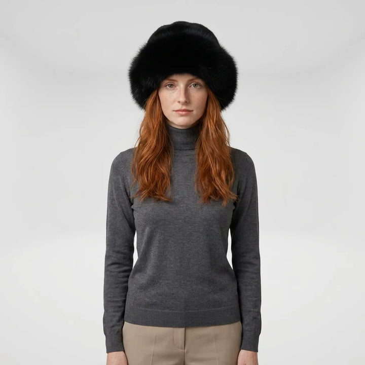 Dark brown faux fur beanie hat worn by model, casual styling