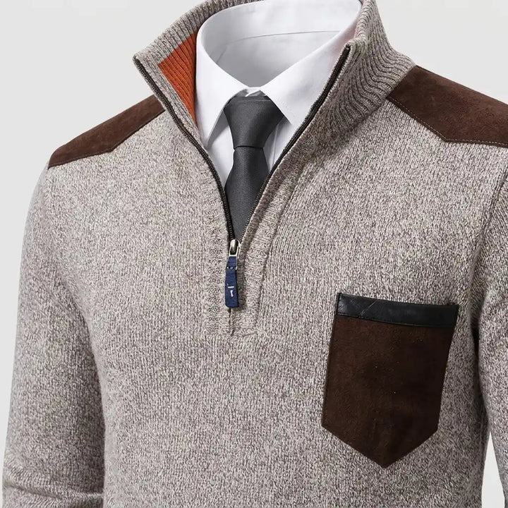 Close-up of half-zip closure and ribbed collar detail on sweater