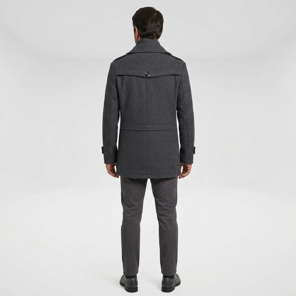 Man wearing gray men's winter overcoat — back view showing yoke seam and epaulettes