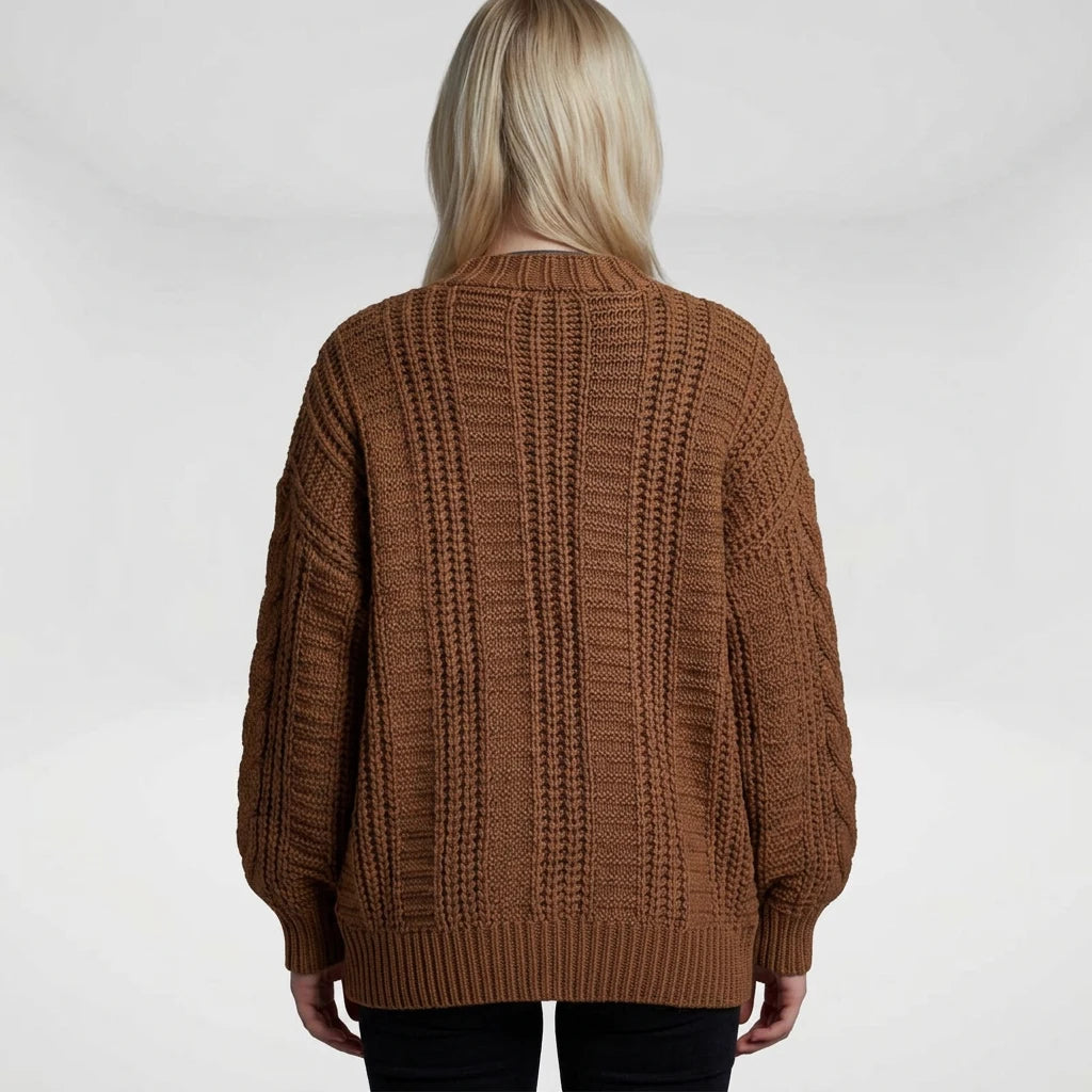 Women's chunky cable knit cardigan side view with lantern sleeves